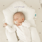 Close-up of the BONEROSHOP Baby Sleep Cushion showing the soft 100% cotton cover and ergonomic contours.