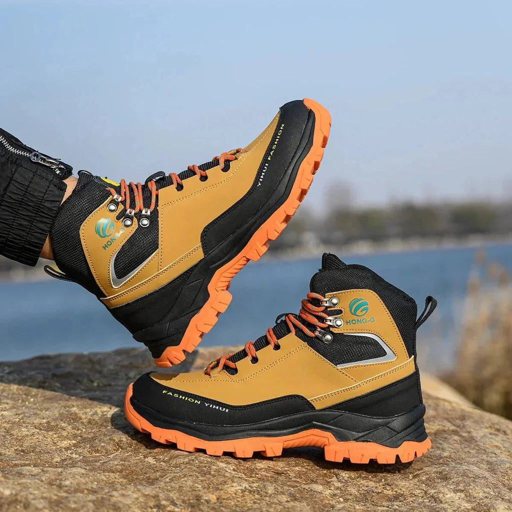 Side view of HONG-G high-cut work boots showing cut-resistant construction and robust design