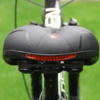 Side profile of CLOUDCOMFORT PRO bicycle saddle showing shock-absorbing construction.