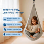 Black therapeutic swing for children, supporting balance and emotional regulation.