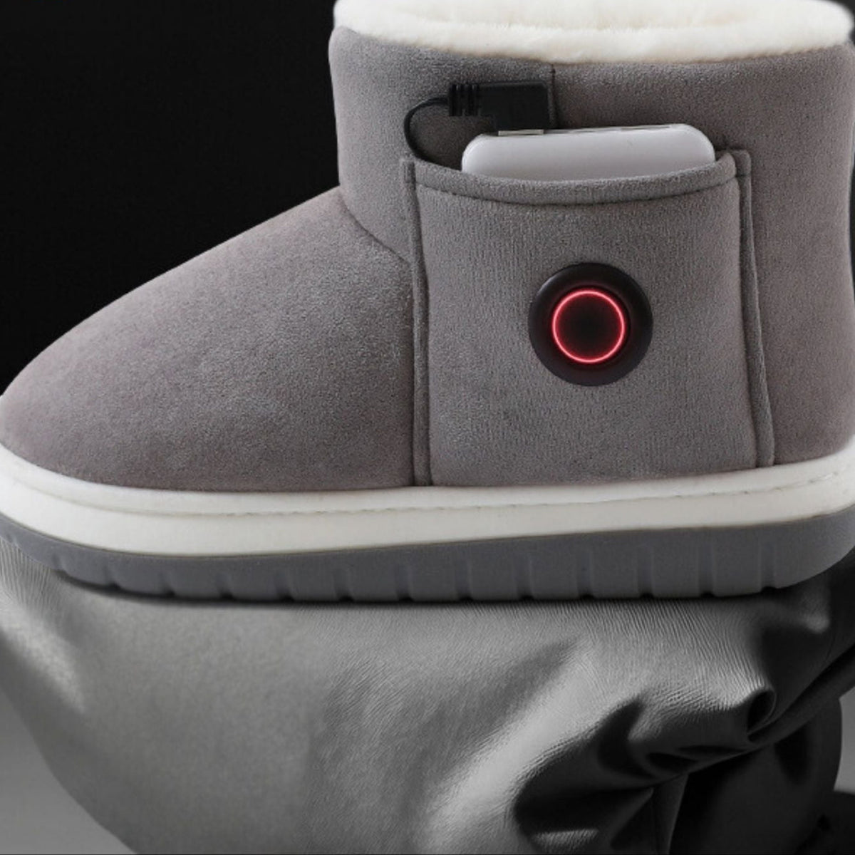 Person wearing USB heated slippers at home demonstrating comfort and warmth