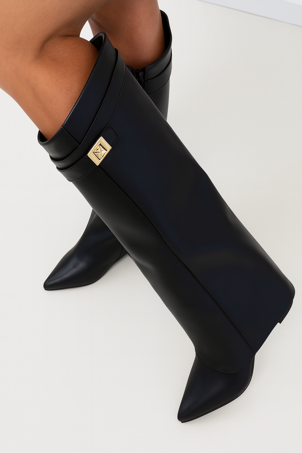 Detail shot of women's premium suede knee-high boots highlighting soft interior lining and quality craftsmanship.