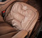 Driver using the Velario car cushion demonstrating improved posture and comfort.