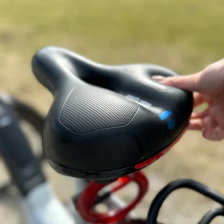 CLOUDCOMFORT PRO bicycle saddle in use during outdoor cycling, illustrating all-weather durability.