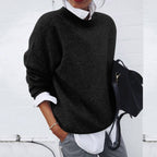 Lifestyle image of the cashmere jumper styled for both office and casual wear, emphasising versatility.