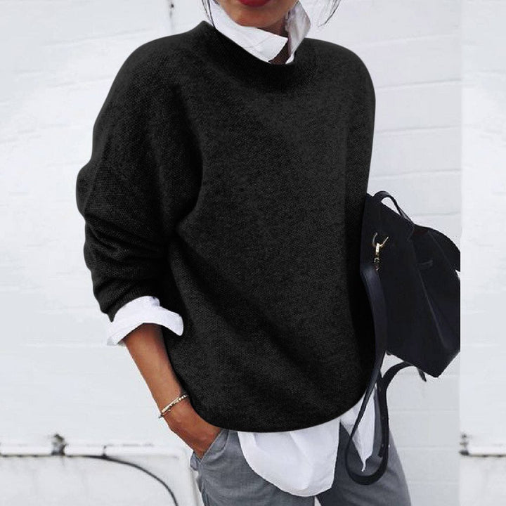 Lifestyle image of the cashmere jumper styled for both office and casual wear, emphasising versatility.