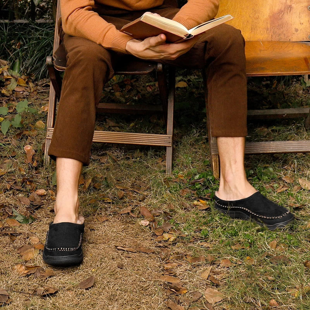 Side view of men's orthopaedic slippers showing supportive structure and decorative stitching