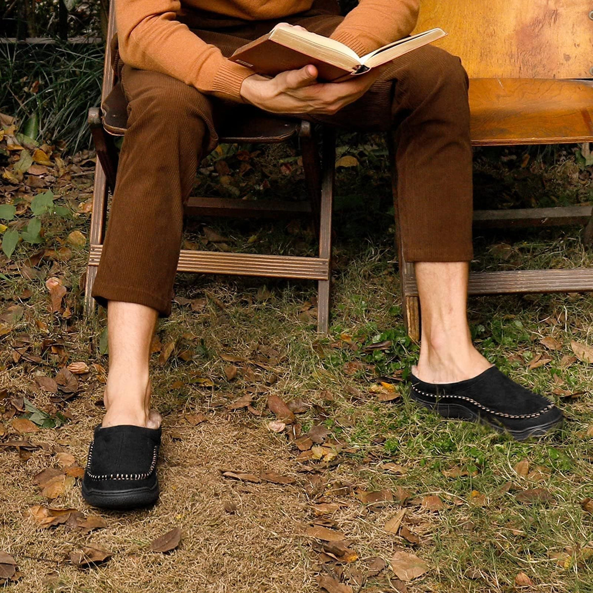 Side view of men's orthopaedic slippers showing supportive structure and decorative stitching