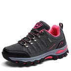 Grey and pink women's hiking shoes displaying quick-lace system detail