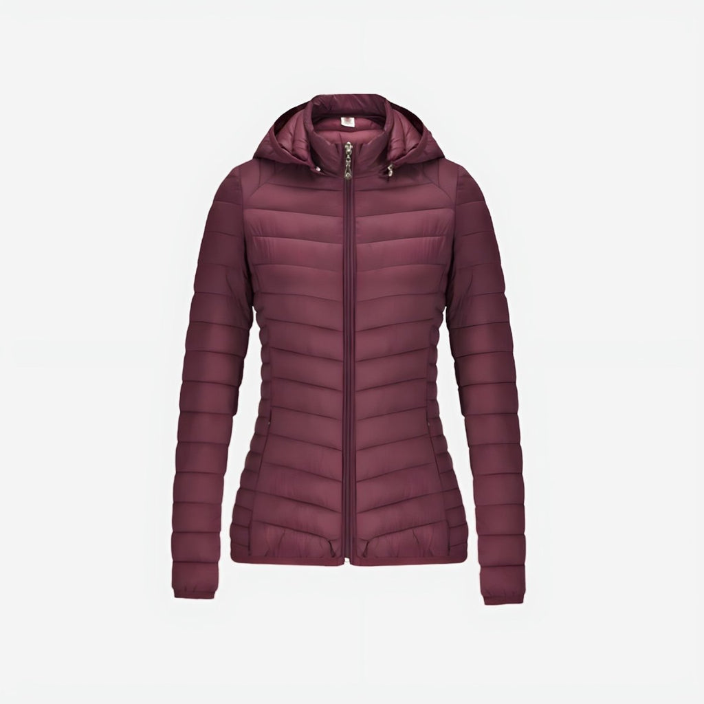 Woman wearing lightweight puffer jacket during outdoor mountain activity