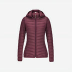 Woman wearing lightweight puffer jacket during outdoor mountain activity
