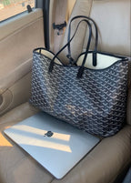 Classic black women's handbag demonstrating timeless elegance and practical design