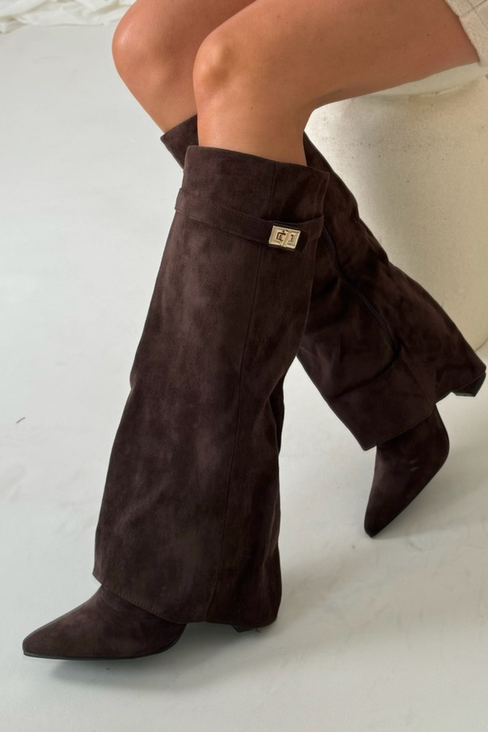 Women's premium leather knee-high boots with fold-over detail, showcasing versatile design and refined elegance.