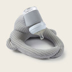 Baby bottle cushion in orange velvet demonstrating correct feeding posture