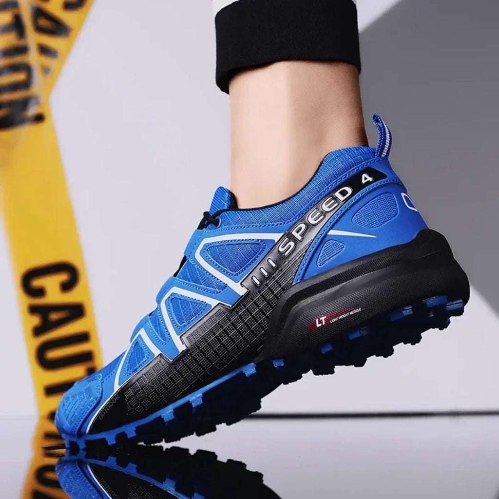 SpeedCross IV trainers on trail surface showcasing deep tread pattern for maximum grip.