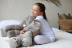 Yellow elephant plush pillow used by baby during tummy time exercise
