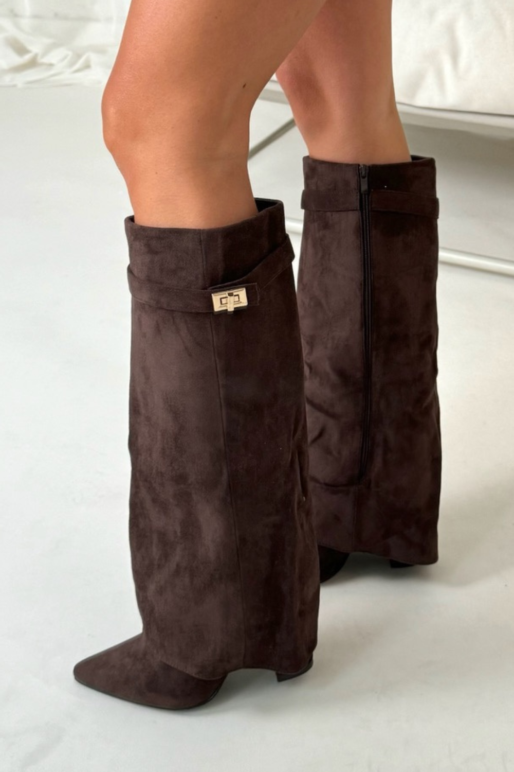 Close-up of block heel and premium materials on women's knee-high boots, emphasising comfort and durability.